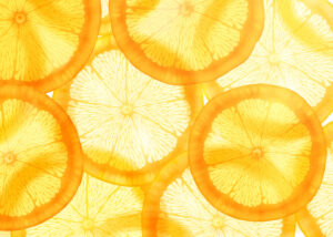 thin slices of citrus fruit with light shining through